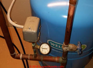 Pressure control switch and pressure tank (C) InspectApedia.com MIke