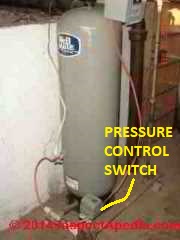 Pressure control switch on water piping near the pressure tank - submersible pump system (C) Daniel Friedman