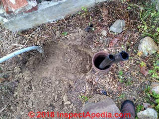Two line jet pump pipes visible at the well casing top (C) Inspectapedia.com Marylin Cook