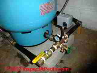 Water tank cross unit or tank tee © D Friedman at InspectApedia.com 