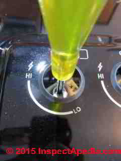 Bosch gas cooktop burner control air adjustment screw being turned (C) Daniel Friedman\
