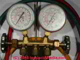 Photograph of a
commercial air conditioning compressor charging gauge set (C) InspectAPedia.com