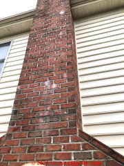 hairline crack in brick chimney (C) InspectApedia.com SPatt