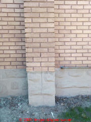 Vertical crack at the center of a masonry chimney - (C) InspectApedia.com M