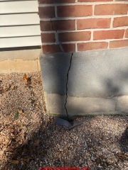 Cracked chimney base means flue could be unsafe (C) InspectApedia.com DP