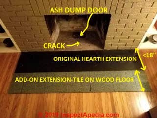 Fireplace hearth extension set as thin tile on existing wood floor - possible fire hazard (C) Daniel Friedman at InspectApedia.com