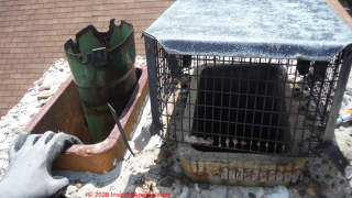 Multiple damage and hazards make the safety of these chimney flues and the chimney itself considered unsafe (C) InspectApedia.com DH