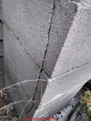 Vertical split frost damaged concrete block chimney (C) InspectApedia.com Kevin