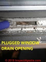 Check sliding window track drain openings for clogs (C) Daniel Friedman at Inspectapedia.com