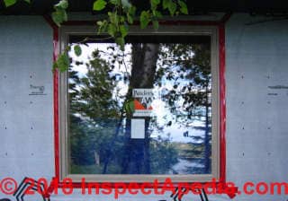 Window frame taped to housewrap (C) Daniel Friedman at InspectApedia.com