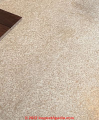 Armstrong vinyl flooring has 9% asbestos chrysotile  (C) InspectApedia.com SueW