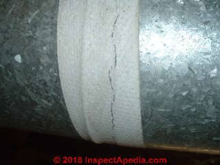 Asbestos paper tape on metal HVAC ducts at joints (C) Inspectapedia.com KB