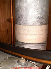 asbestos paper tape wrapped around joints in metal ductwork (C) InspectApedia.com NikkiSmirl