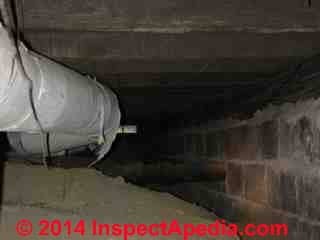 Asbestos paper wrap insulation on heating ducts in a dirt crawl (C) Daniel Friedman cobleigh