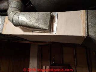 Asbestos paper on HVAC air duct exterior (C) InspectApedia.com Allen