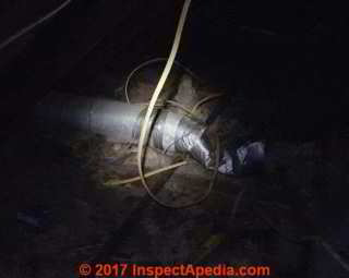 Metal or foil covered asbestos paper reinforced with jute inside of an HVAC duct (C) InspectApedia.com Tina
