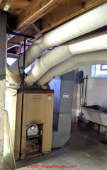 White wrapped furnace ductwork (C) InspectApedia.com Jimchait