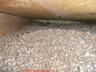 brown granular attic insulation - Vermiculite? (C) InspectApedia.com Smith