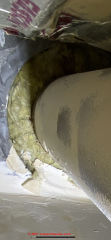 Fiberglass vent insulation (C) InspectApedia.com HelpID