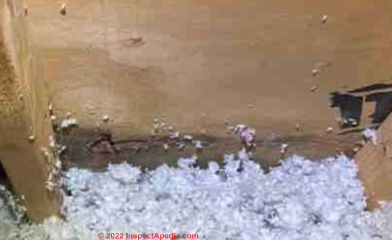 Dark mold stains on attic plywood at house gable end, not eaves (C) InspectApedia.com cuccaro