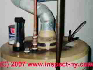 Photograph of a flue gas spill at a water heater (C) Daniel Friedman