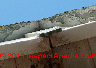 Painted but worn fiber cement roof, possibly roofed-over with other materials (C) InspectApedia.com Lindsay