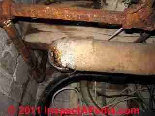 Asbestos pipe insulation © D Friedman at InspectApedia.com 