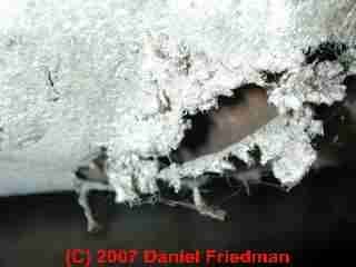 Photograph of asbestos paper duct wrap in poor condition