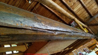 Checking in logs spanning the full cabin width since 1935 (C) Daniel Friedman at InspectApedia.com