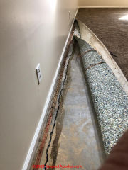 Shrinkage crack around perimeter of concret floor slab (C) InspectApedia.com JD