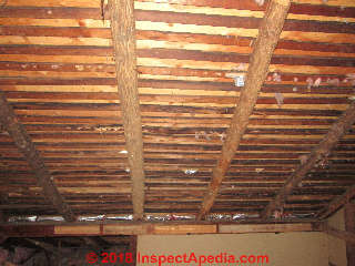 Log rafters in an 1865 ranch inspected by home inspector Dobver Kahn (C) InspectApedia.com 2018