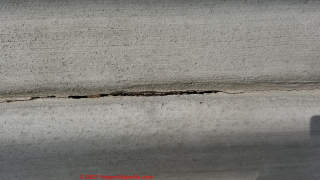 Crack appears in concrete control joint - just as it should (C) InspectApedia.com L