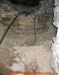 Stones removed from stone foundation can destroy its structural integrity © Daniel Friedman at InspectApedia.com