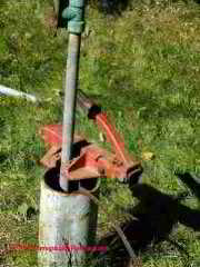 Well pulling clamp keeps from dropping the pipe back into the well © D Friedman at InspectApedia.com 