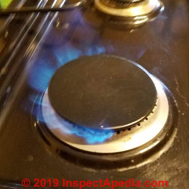 Roaring gas burner flame, flame lifting off of the burner - over-pressure (C) Daniel Friedman at InspectApedia.com