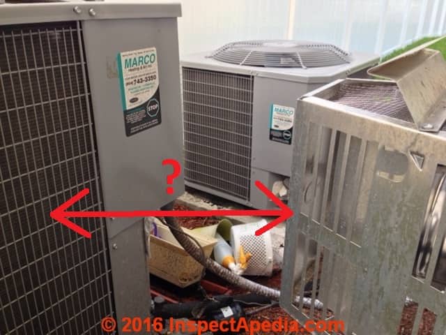 Gas fireplace vent too close to air conditioner compressor/condenser unit (C) InspectAPedia.com