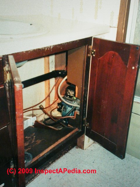 Oil burner in bath vanity (C) Daniel Friedman
