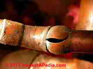 Frozen copper water line shows freeze stresses (C) Daniel Friedman