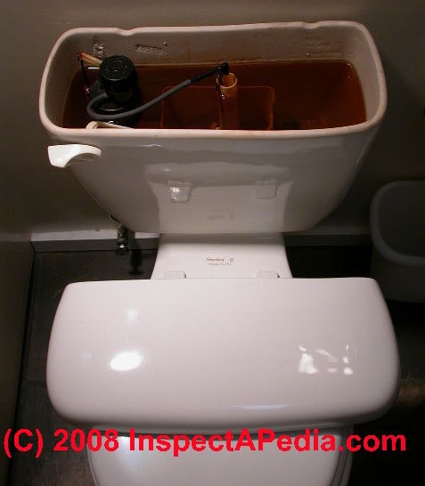 Toilet with tank lid on seat(C) Daniel Friedman