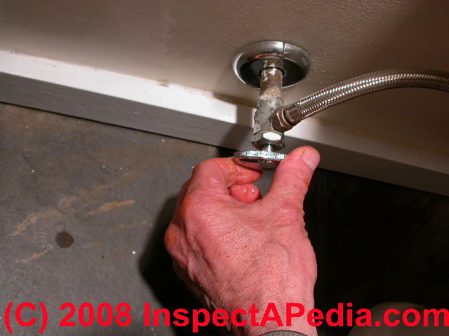 Closing the toilet fill valve (C) Daniel Friedman at InspectApedia.com