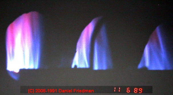 Photograph of  this gas flame which gives a clue that there may be an operating problem and an unsafe gas furnace in this building