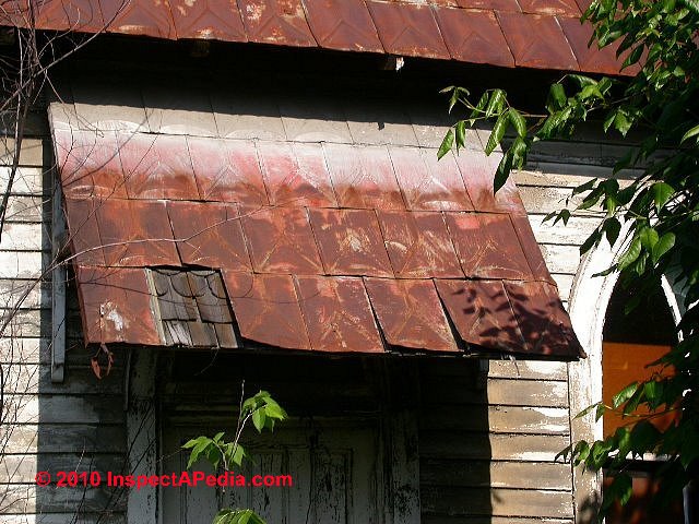Rusted, blown-off, worn-out Metal shingle roof, Clintondale NY (C) Daniel Friedman