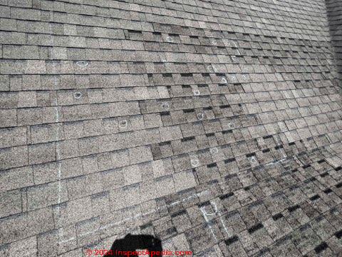 dark areas are not hail damage (C) InspectApedia.com Lesli