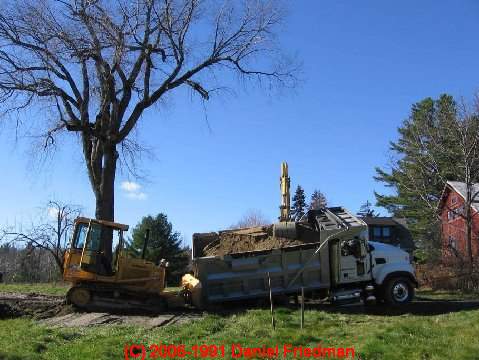 PHOTO of a septic seepage pit collapse when a truck drove over it.