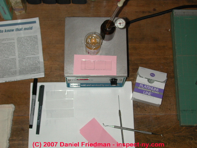 Photograph of preparation of a microscope slide using Cargille's Meltmount.