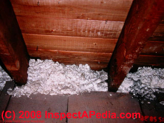 Mineral wool insulation in an attic (C) InspectApedia.com Daniel Friedman