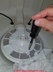 Access the strainer & pump in a Maytag dishwasher (C) Daniel Friedman at InspectApedia.com