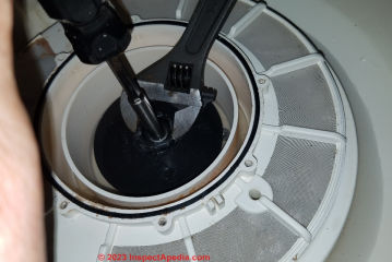 How to remove the impeller from a Maytag dishwasher pump assembly (C) Daniel Friedman at InspectAPedia.com