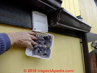 Lint-clogged screen on clothes dryer vent (C) Daniel Friedman