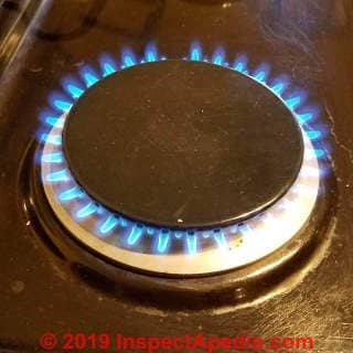 Normal gas burner flame on a range top (C) Daniel Friedman at InspectApedia.com
